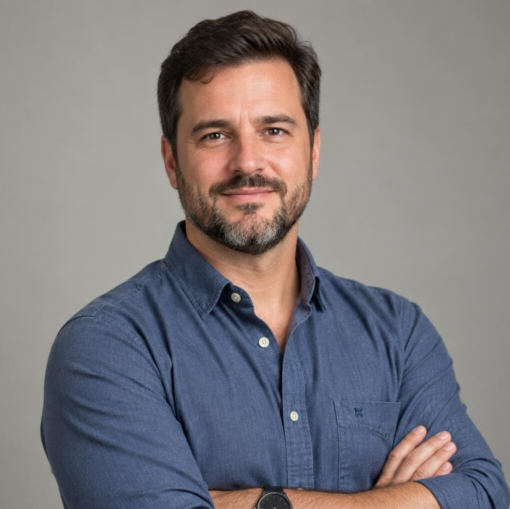 Portrait of a Brazilian man with a short beard smiling
